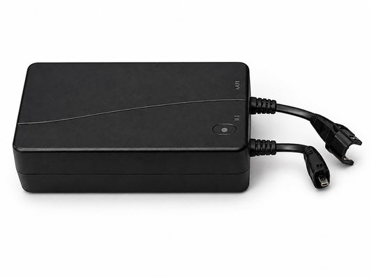 Pro Motion 1800 mAh rechargeable battery pack on white, showing the labelled IN and OUT ports and both 2-pin leads